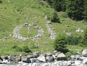 Bob Budd. Digital Bells(the binary code), 2010. Local rocks. 2300 x 1200 cm. Mandarfen, Austria. www.axisweb.org/artist/bobbudd