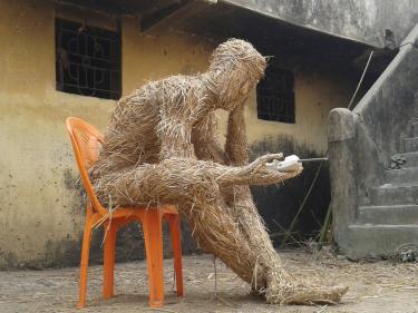 "Ecological man" ,India 2017. Rice straw, bamboo, chair, rope, telephone, 115 x 130 x 80 cm